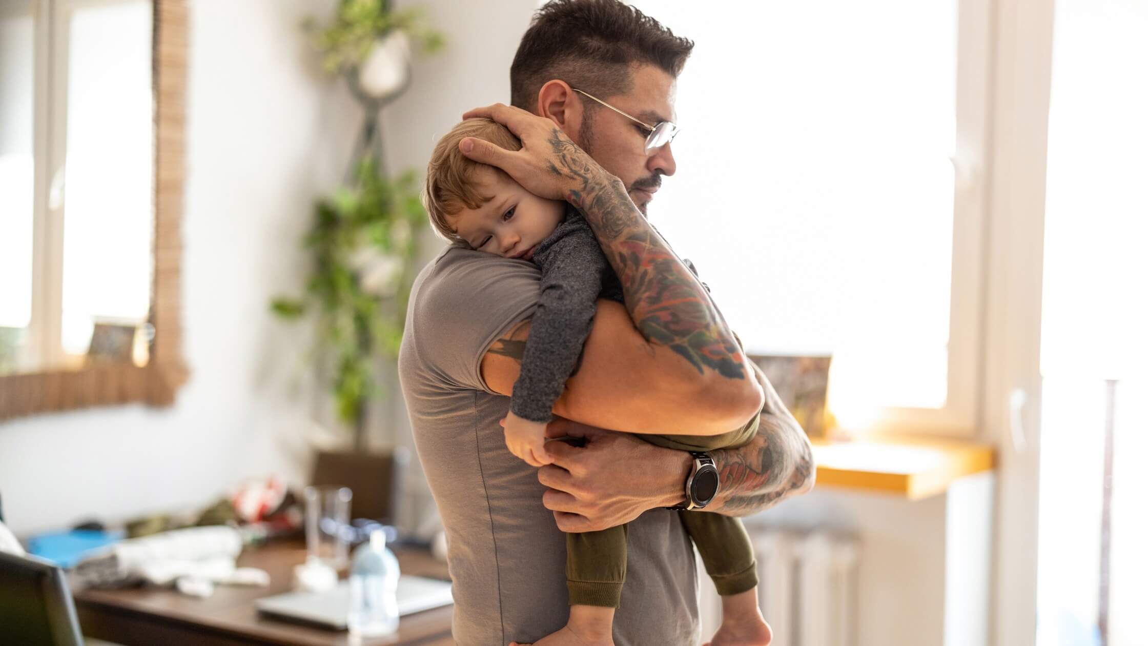 daddy holding baby trying to sleep