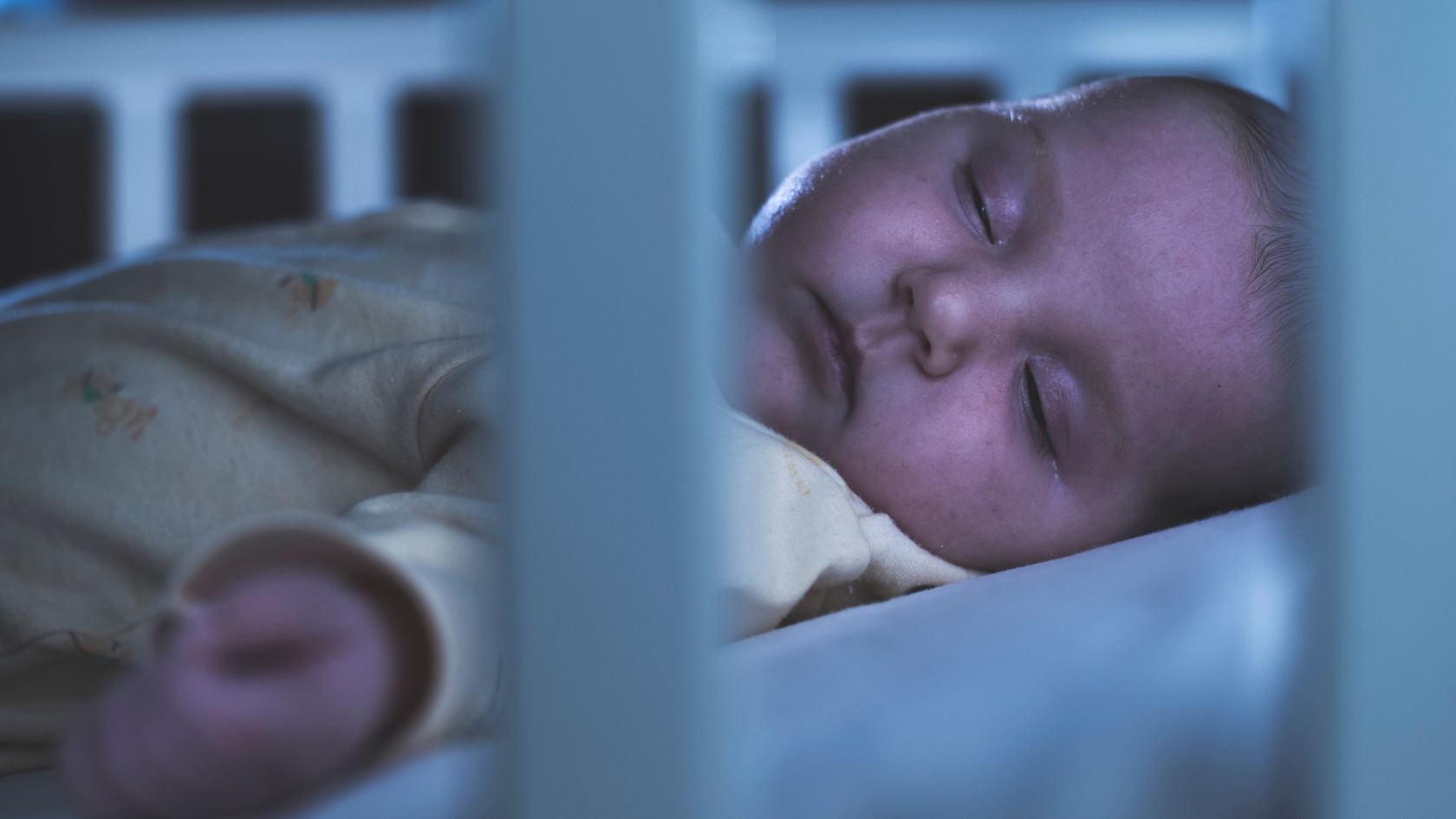 night baby sleeping in crib