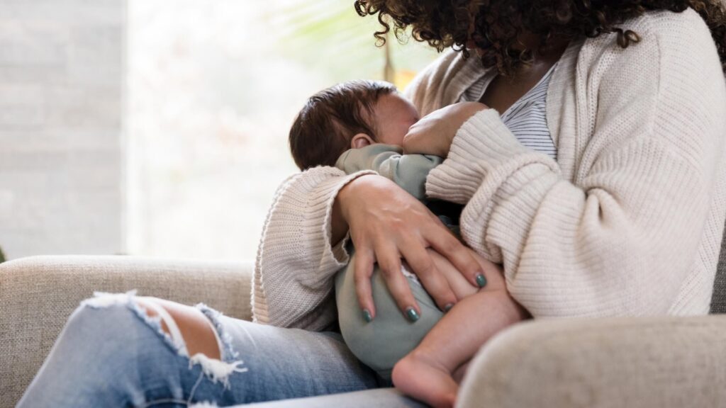 woman breastfeeding baby for sleep training