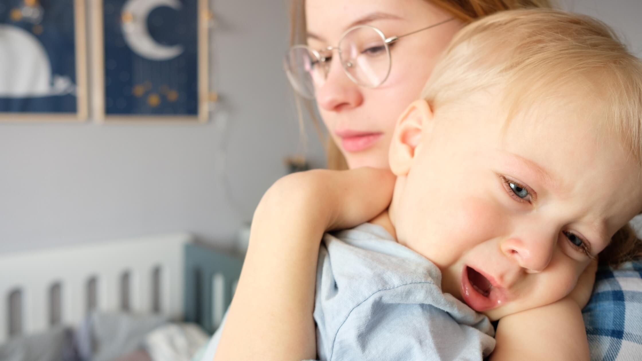 mother trying to put baby to sleep for day nap