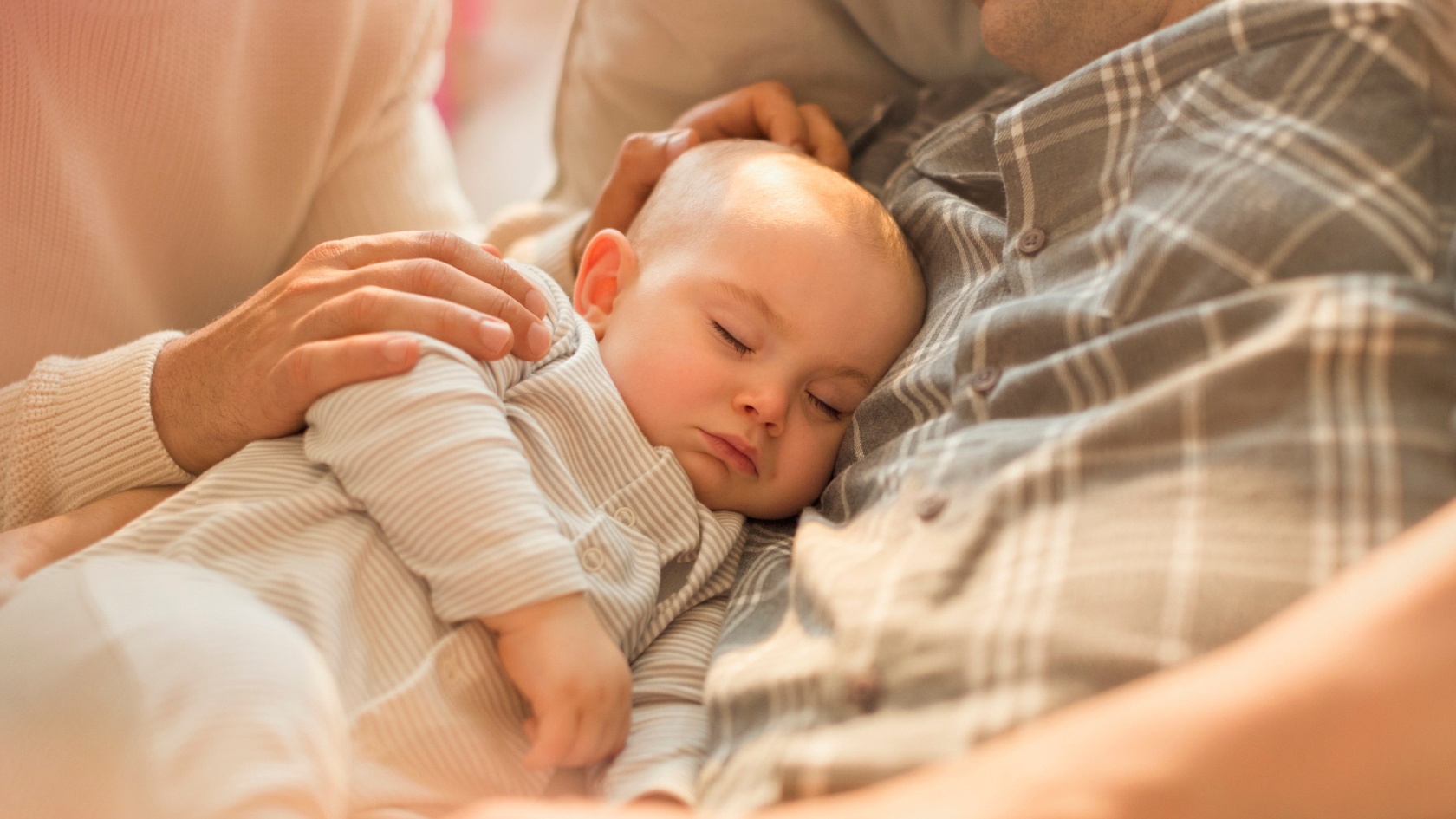 sleeping baby on dad's chest