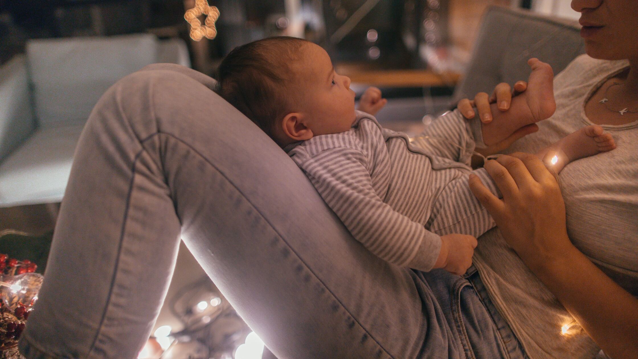 woman holding baby at night during witching hour